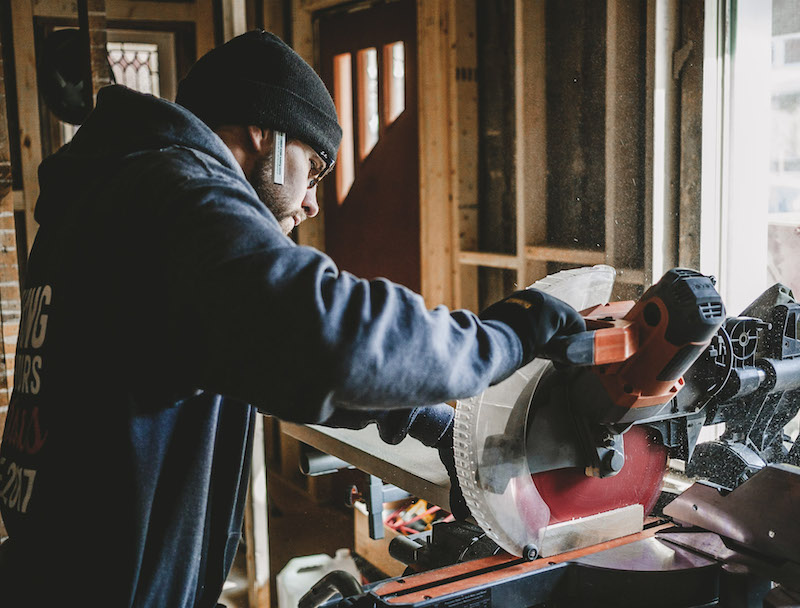 Jesse cutting wood on a skill saw